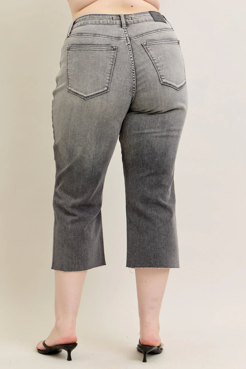 Gray wide-leg capri jeans, back view with two patch pockets and curved yoke