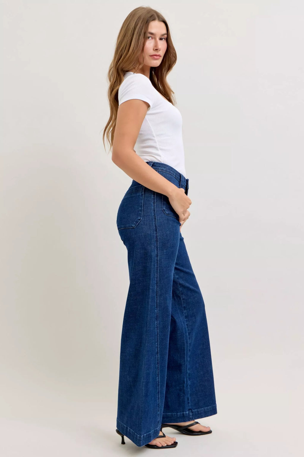 High-waisted wide-leg jeans, dark wash, flared hem and back pocket view