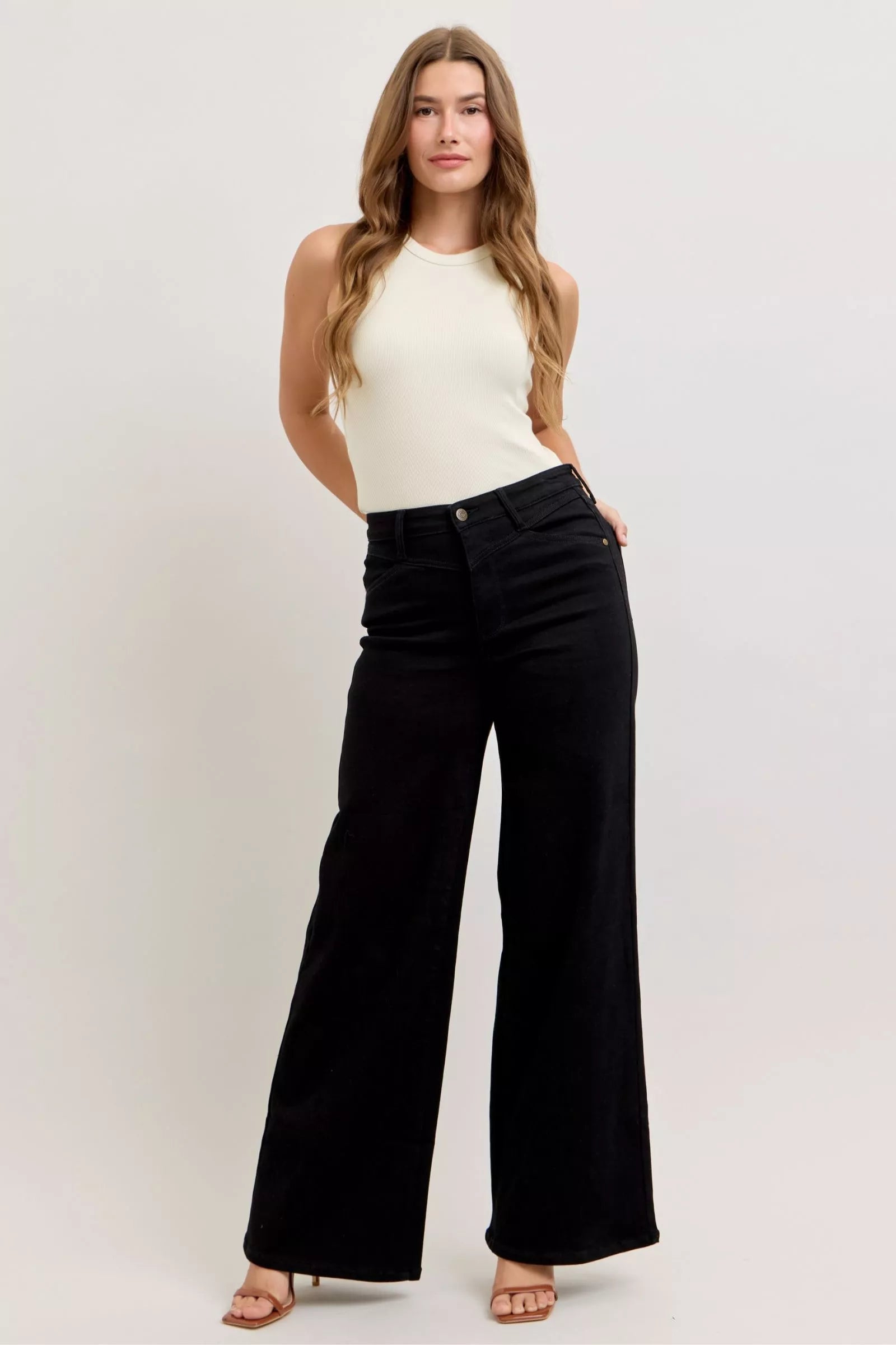 Black high-waisted wide-leg jeans with button fly and wide straight legs