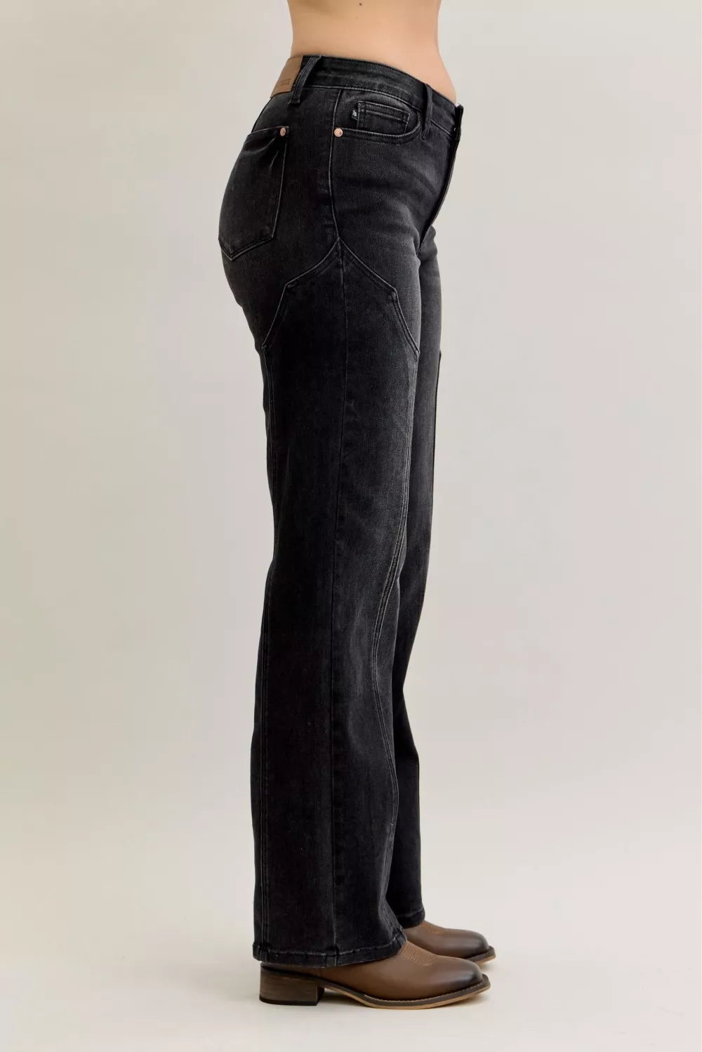 Black mid-rise straight jeans, side view with five-pocket styling