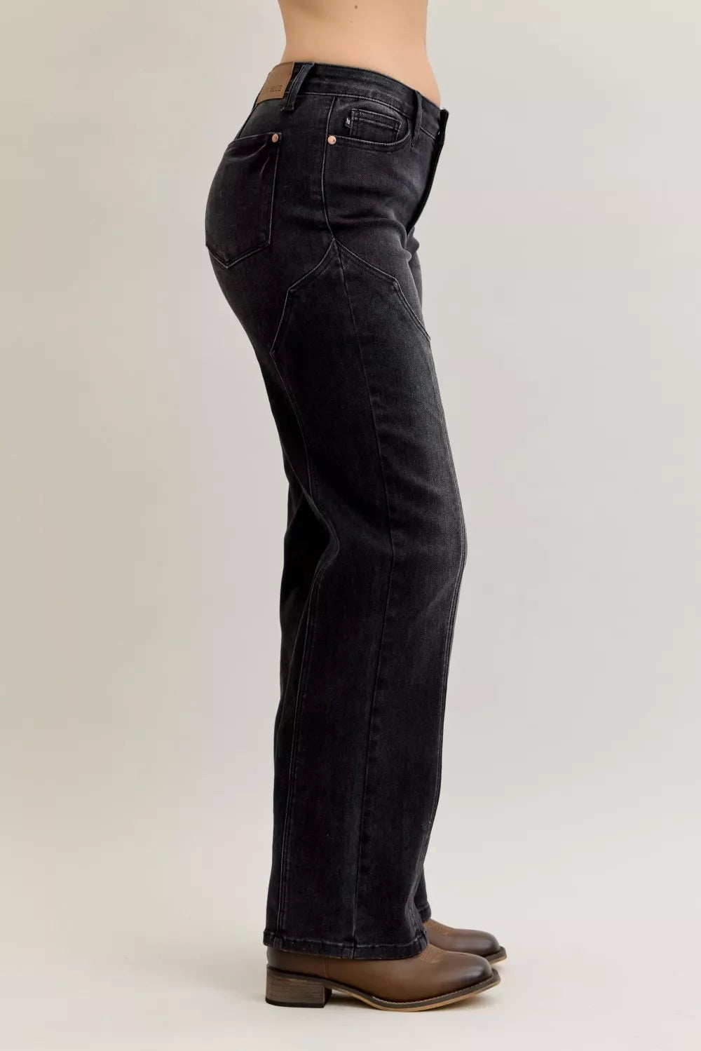 Black jeans, back-side view with western seam stitching and rear pockets