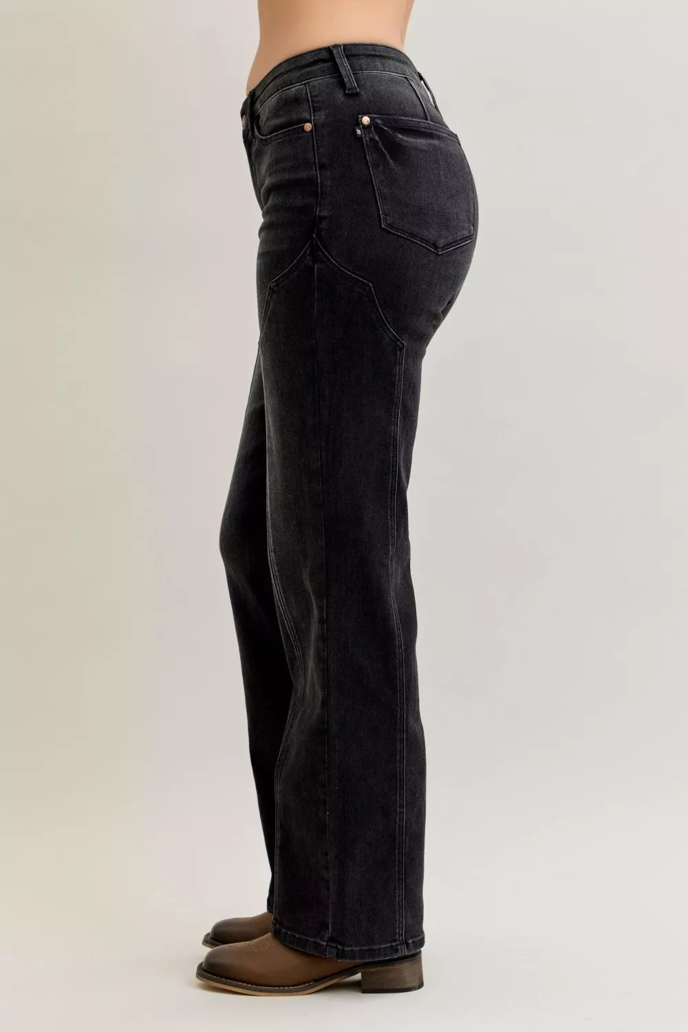 Black jeans angled back view, western seam stitching and rear pocket