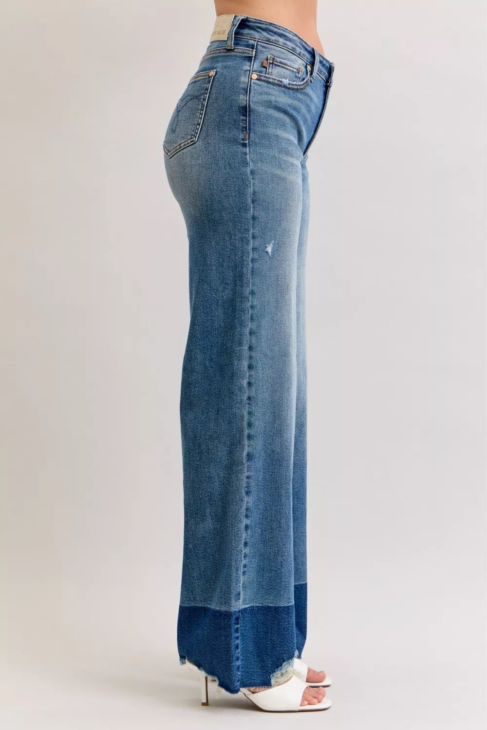 Dark wash (DK) high-waist straight jeans, back view with raw hem