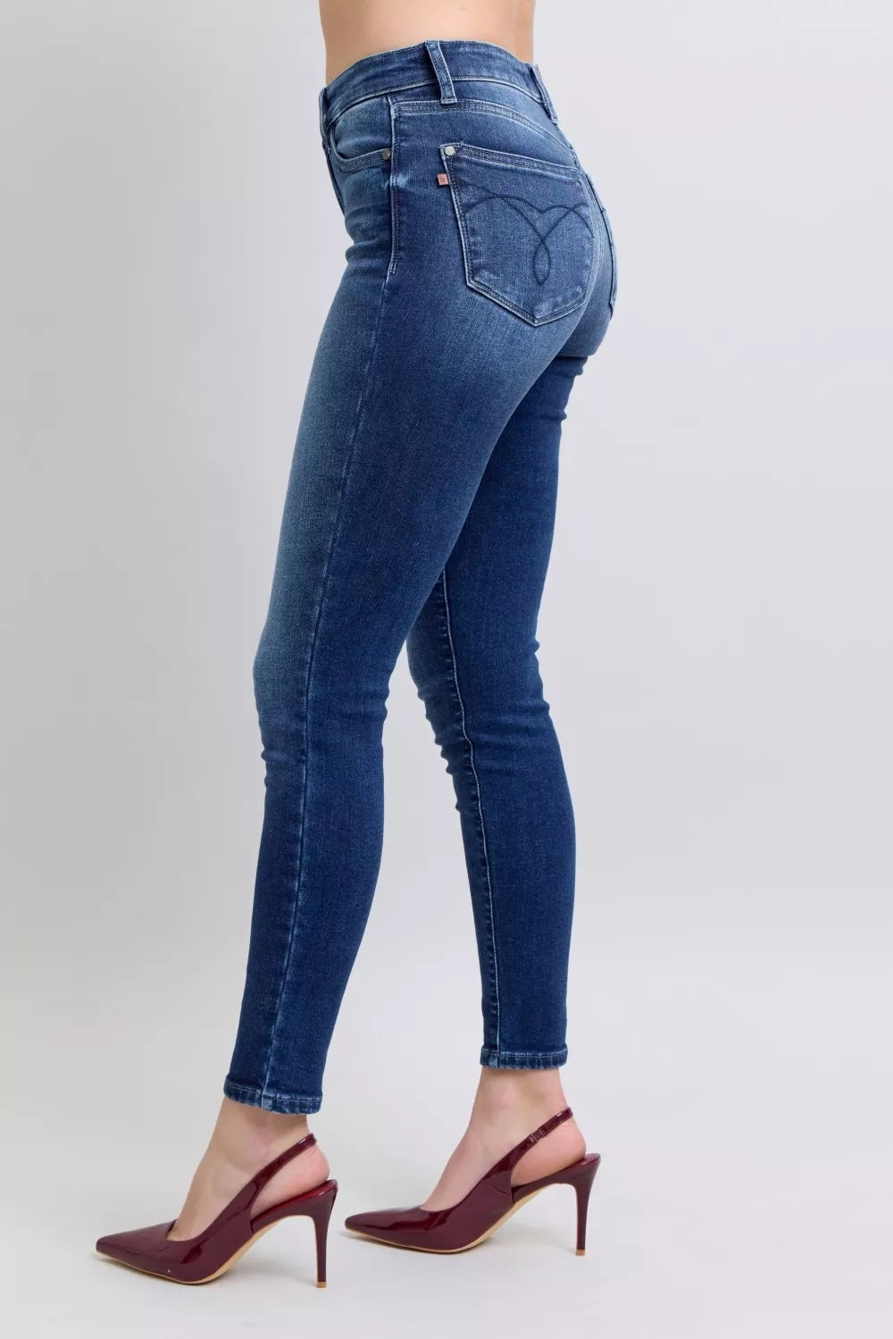 Dark blue skinny jeans with back yoke and embroidered-style pocket detailing