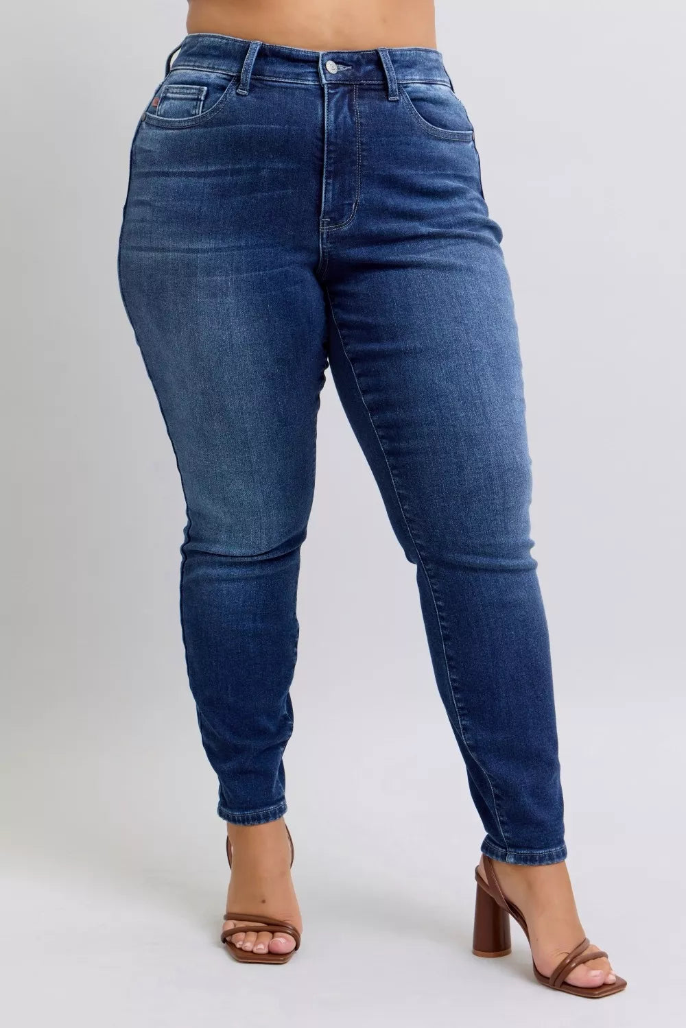 Dark blue washed thermal skinny jeans back view with belt loops and skinny leg taper