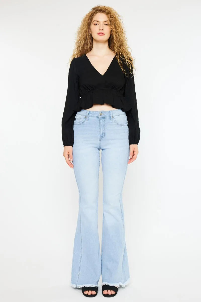 Light wash high-rise curvy flare jeans with frayed hem and front button closure