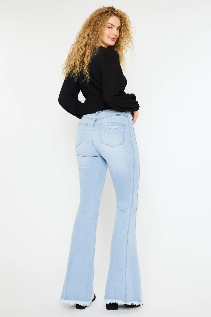 Light wash curvy flare jeans, side view with back pockets and high-rise waist