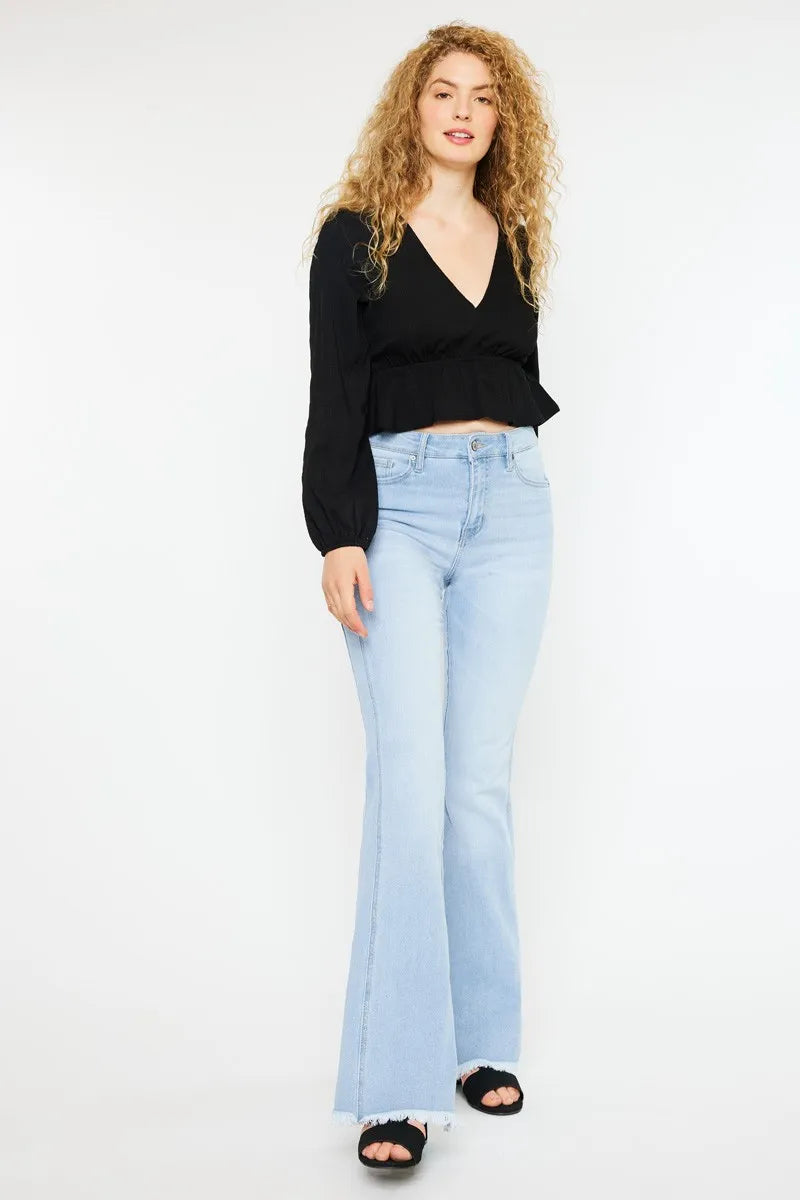 Light wash curvy flare denim with high-rise waist, belt loops, and frayed hem