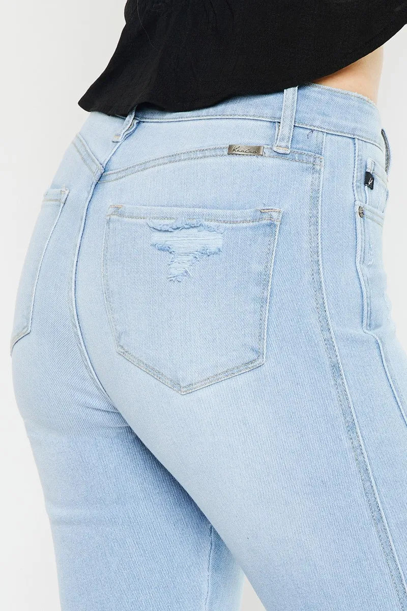 Light wash high-rise curvy flare jeans, back view with stitched pockets and button