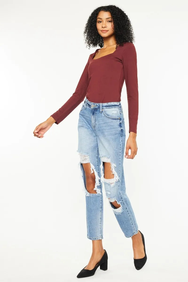 High rise distressed boyfriend jeans, medium wash denim with multiple rips and straight crop