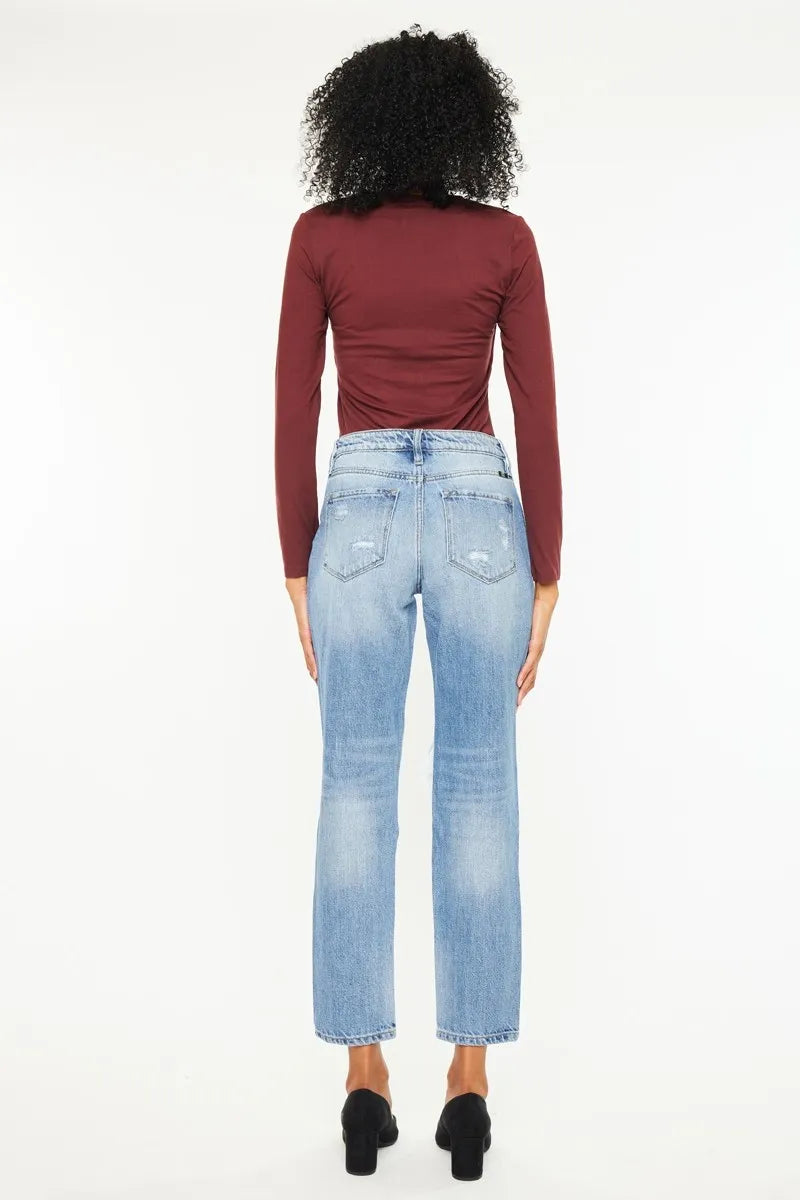 Back view: medium wash high rise boyfriend jeans with faded finish and ripped knee panels