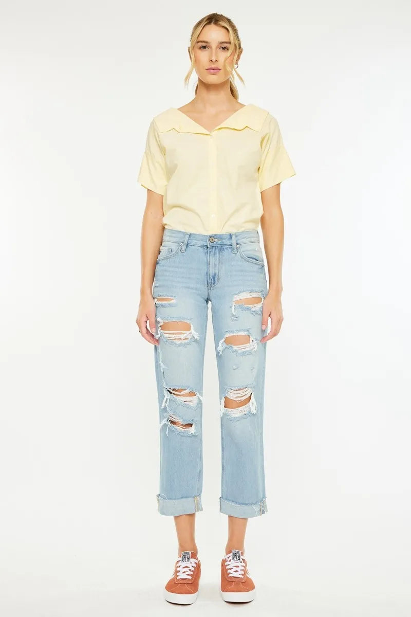 Light wash boyfriend jeans with ripped knees and relaxed straight-leg fit