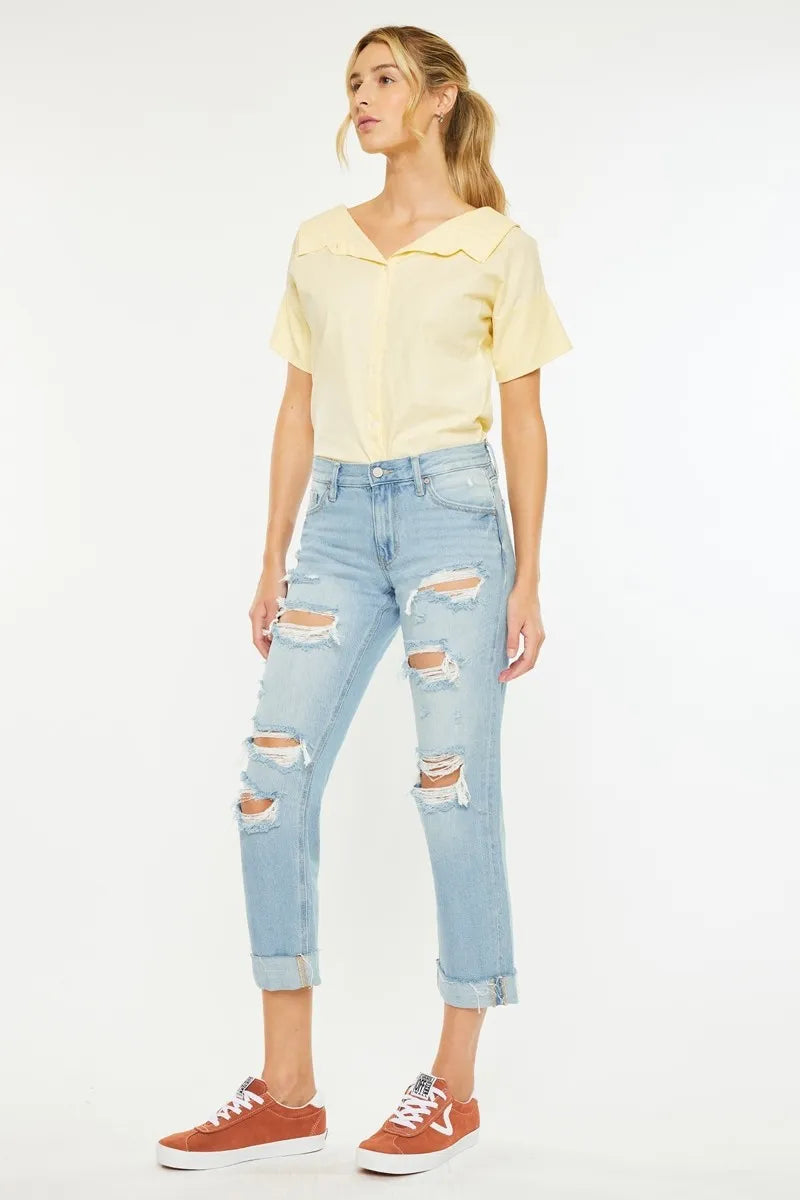 Distressed light wash boyfriend jeans, mid-rise waist and cuffed cropped hem