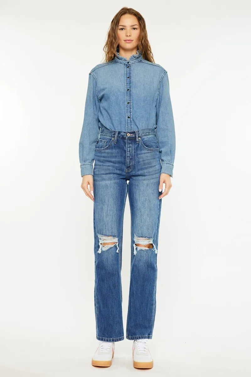 Medium wash high-rise boyfriend jeans with distressed knee rips and belt loops