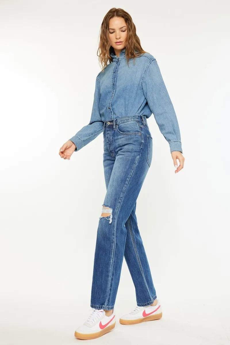 Medium wash boyfriend jeans with high-rise waist and cuffed, ripped hems