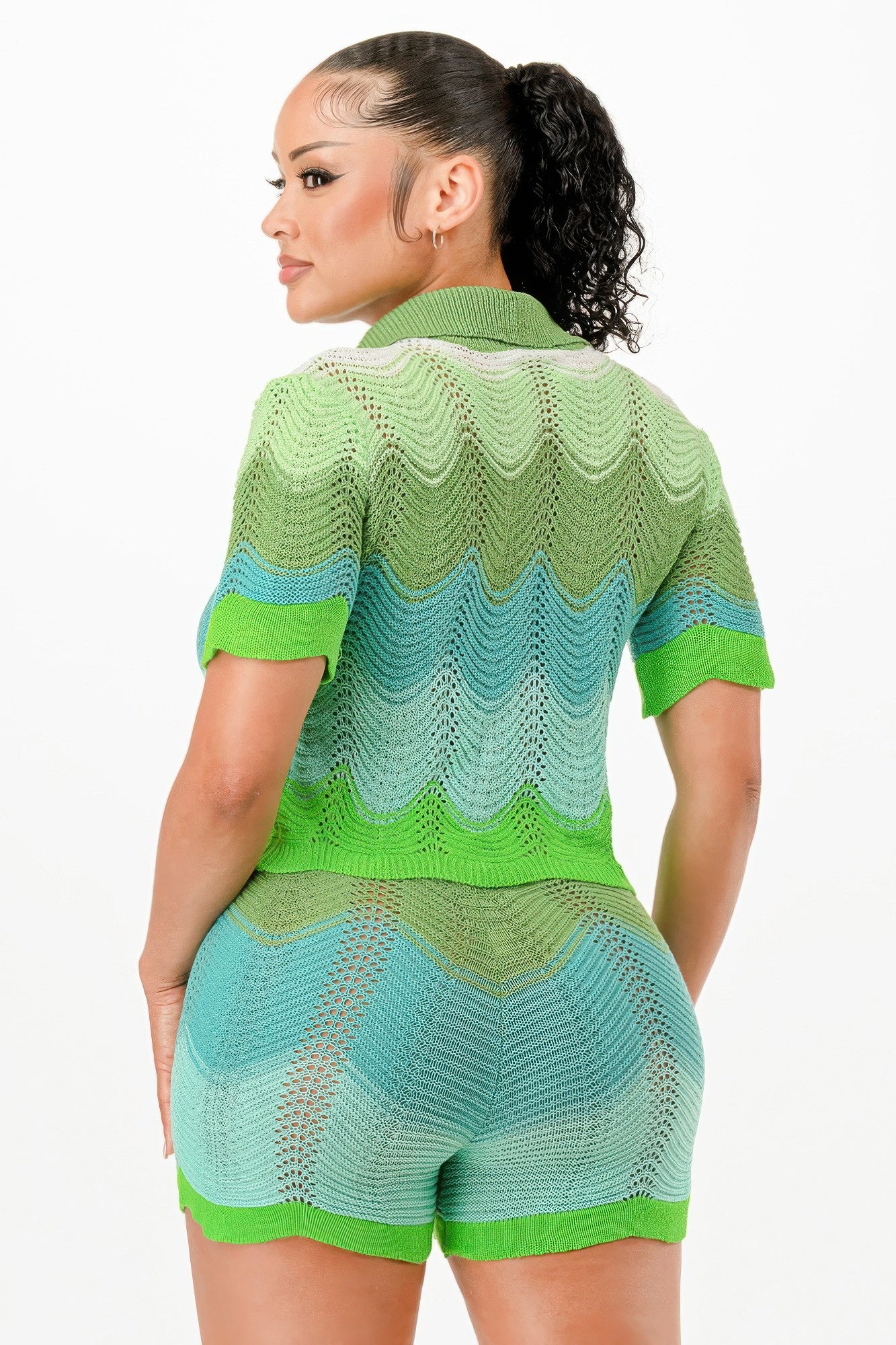 Back view of green-blue knit cardigan and matching drawstring shorts