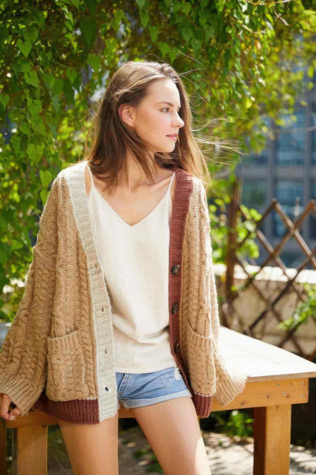 Knit color-block cardigan, open front with ribbed cuffs and dark button detail