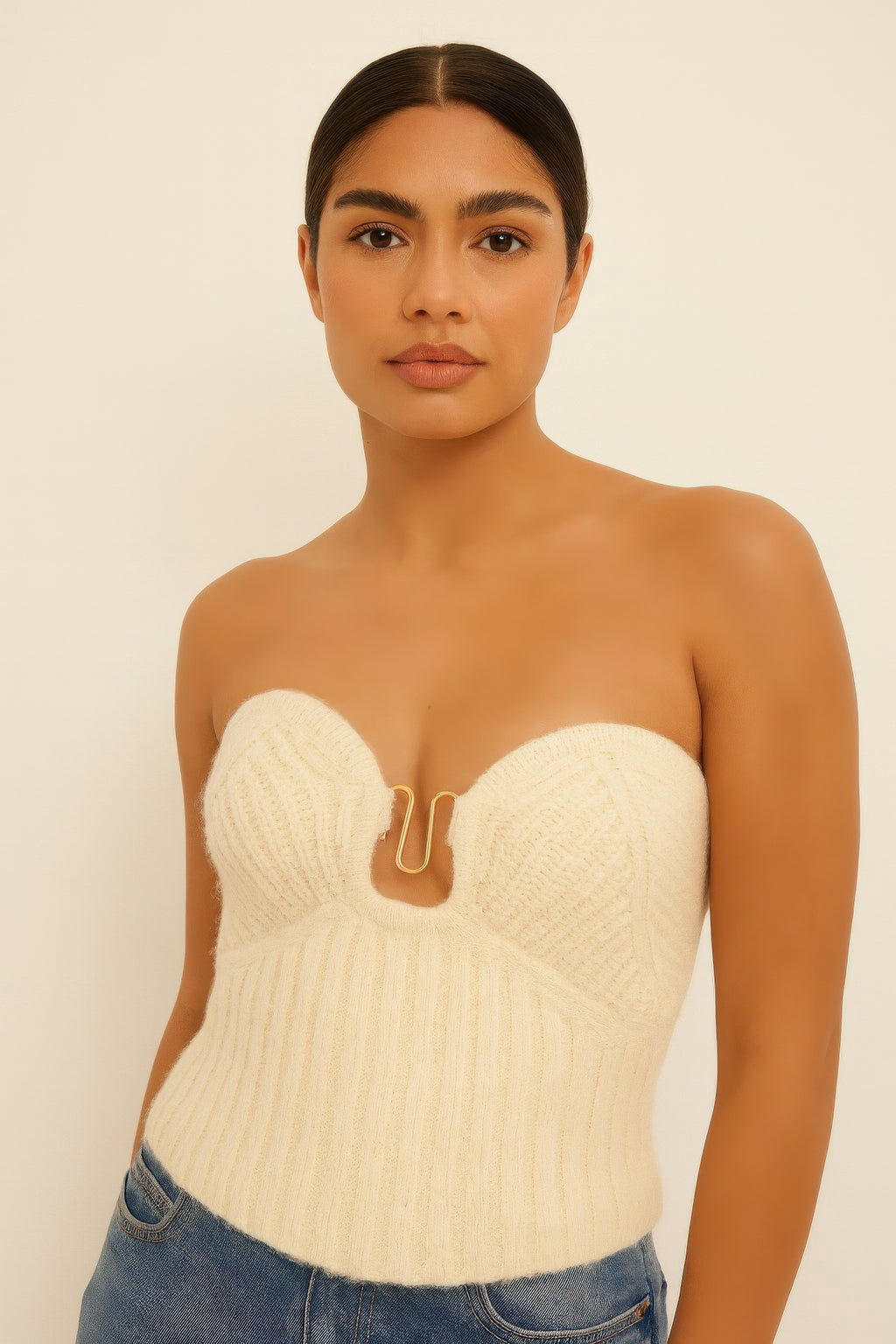 Cream knit tube top with strapless sweetheart neckline and U-ring front detail