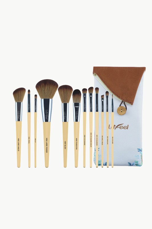 Beige face and eye brush set with pouch, brown bristles, black ferrules