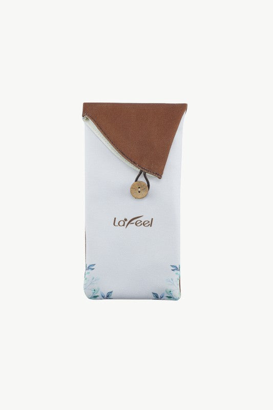 Brush pouch in light fabric with brown flap and blue floral accents, beige set
