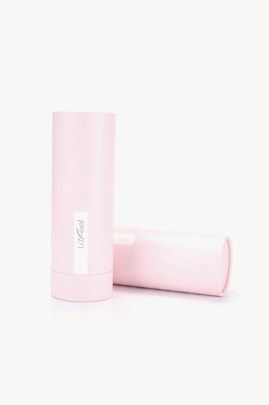 Pink cylindrical brush case with a beige “Lafeel” label and matching lid