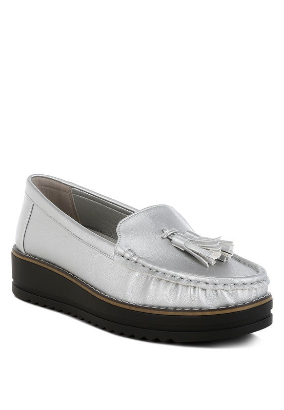 Silver metallic loafer with tassel detail and moc-toe stitching, chunky black sole