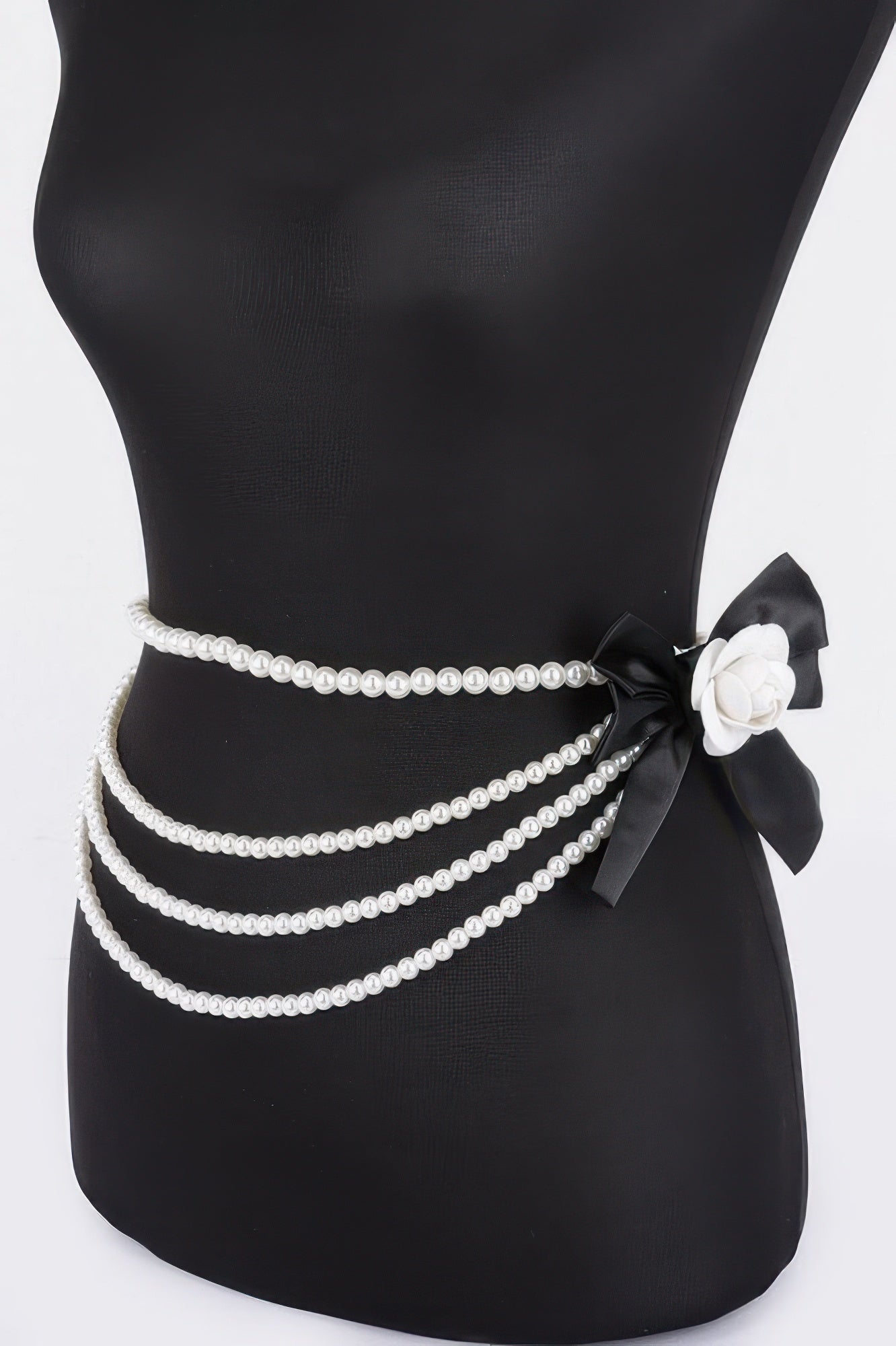 Black layered faux pearl flower ribbon belt with multiple pearl rows and black bow