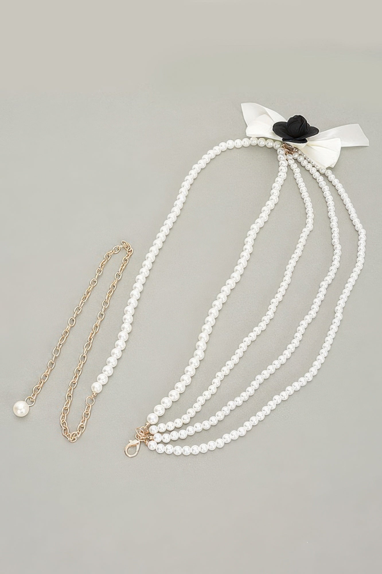 Ivory faux pearl flower ribbon belt with layered pearl strands and dangling pearl charm