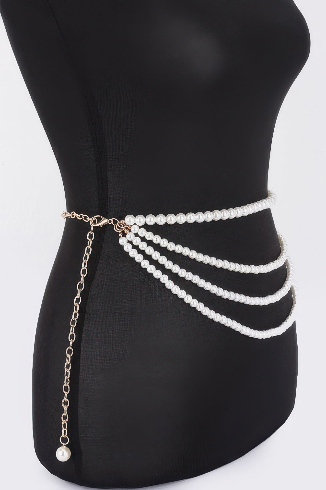 Black layered faux pearl belt with gold chain and pearl tassel at side