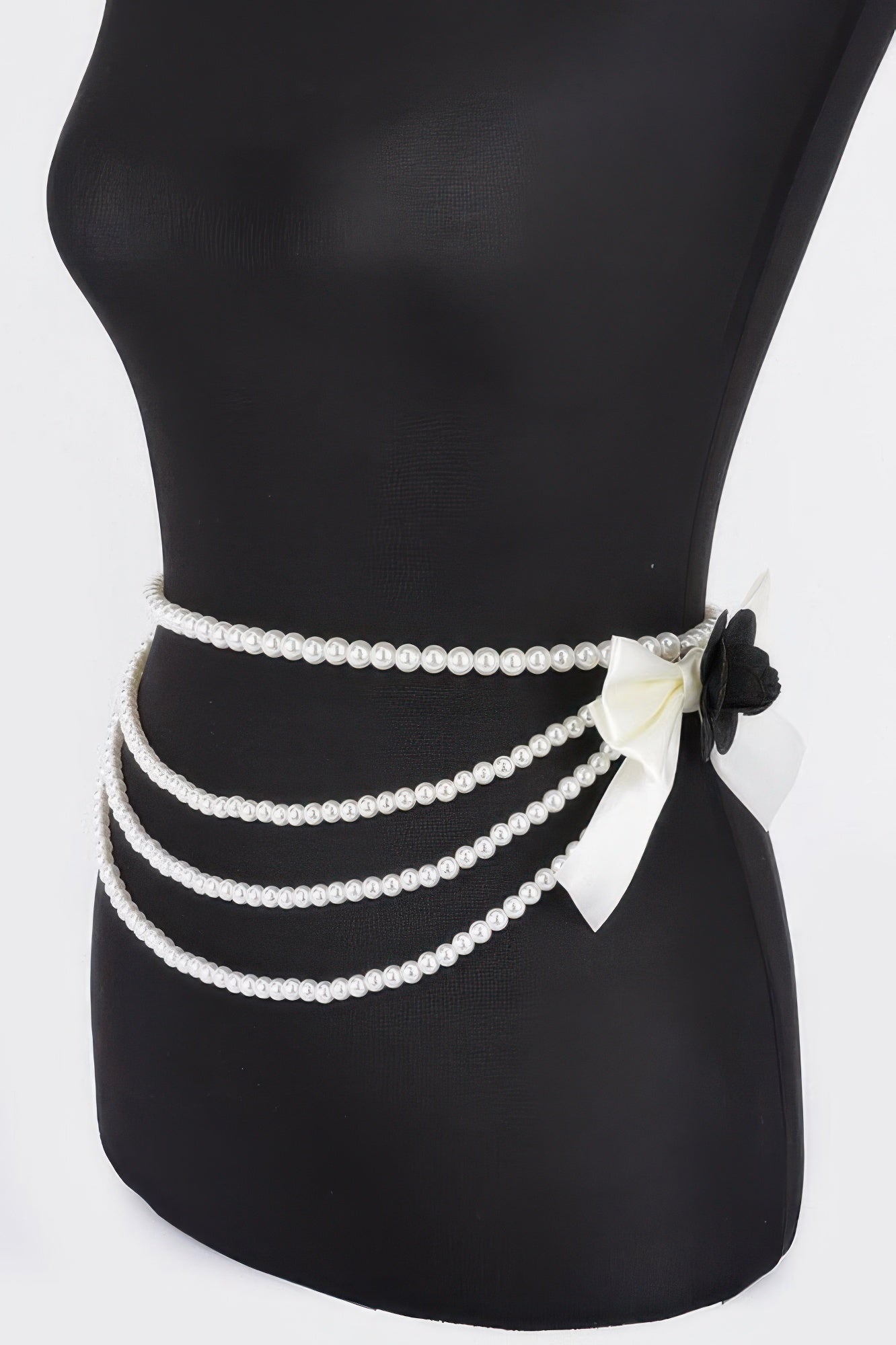 Black belt with faux pearl rows and bow flower accent on side