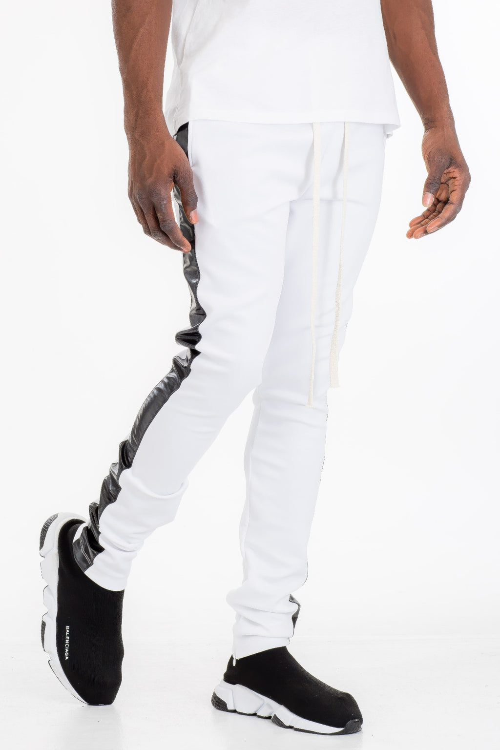 White Leather Tape Track Pants with black tape paneling along the outer leg seams