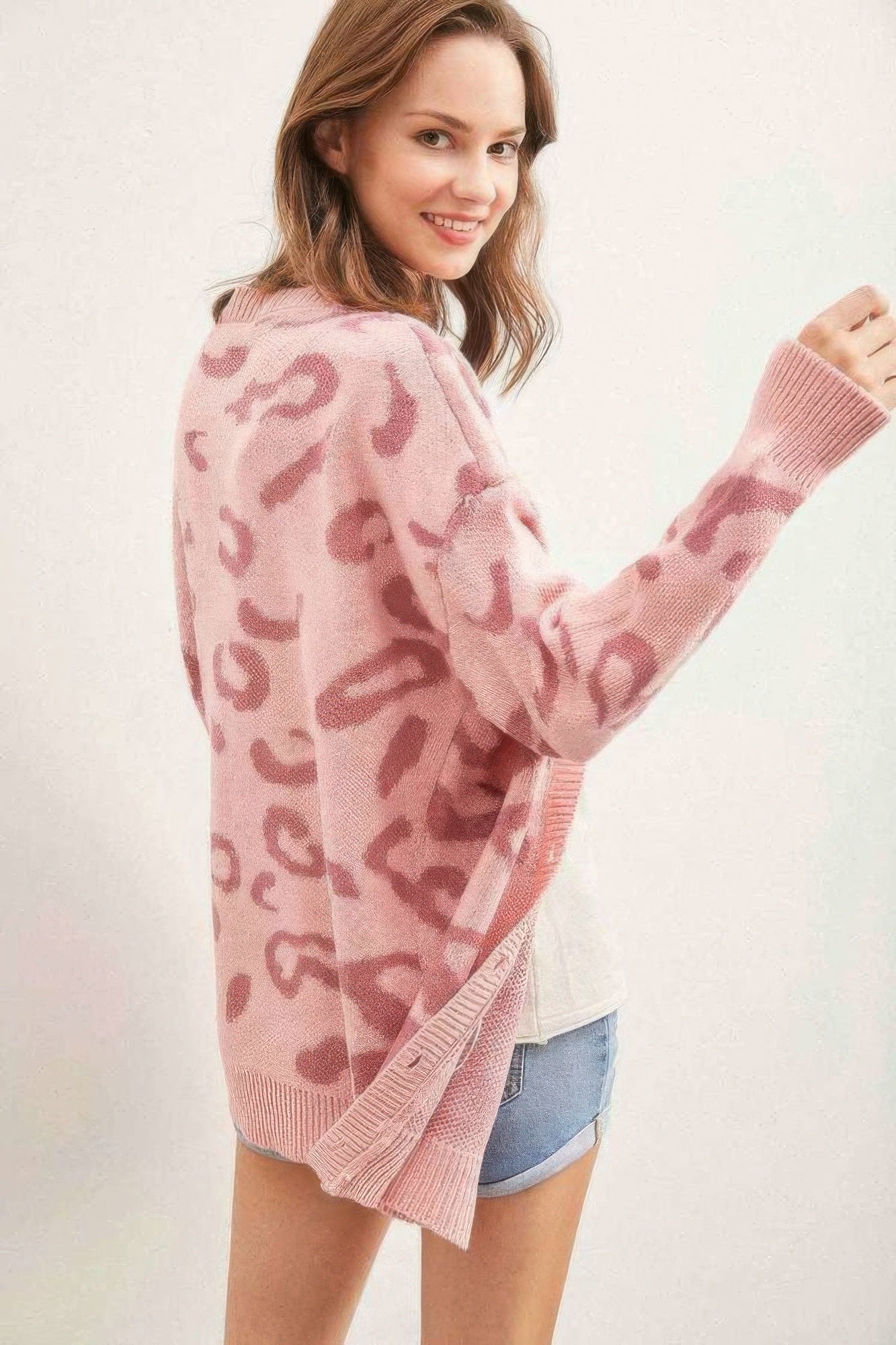 Pink leopard print button cardigan with ribbed hem and knit sleeve cuffs