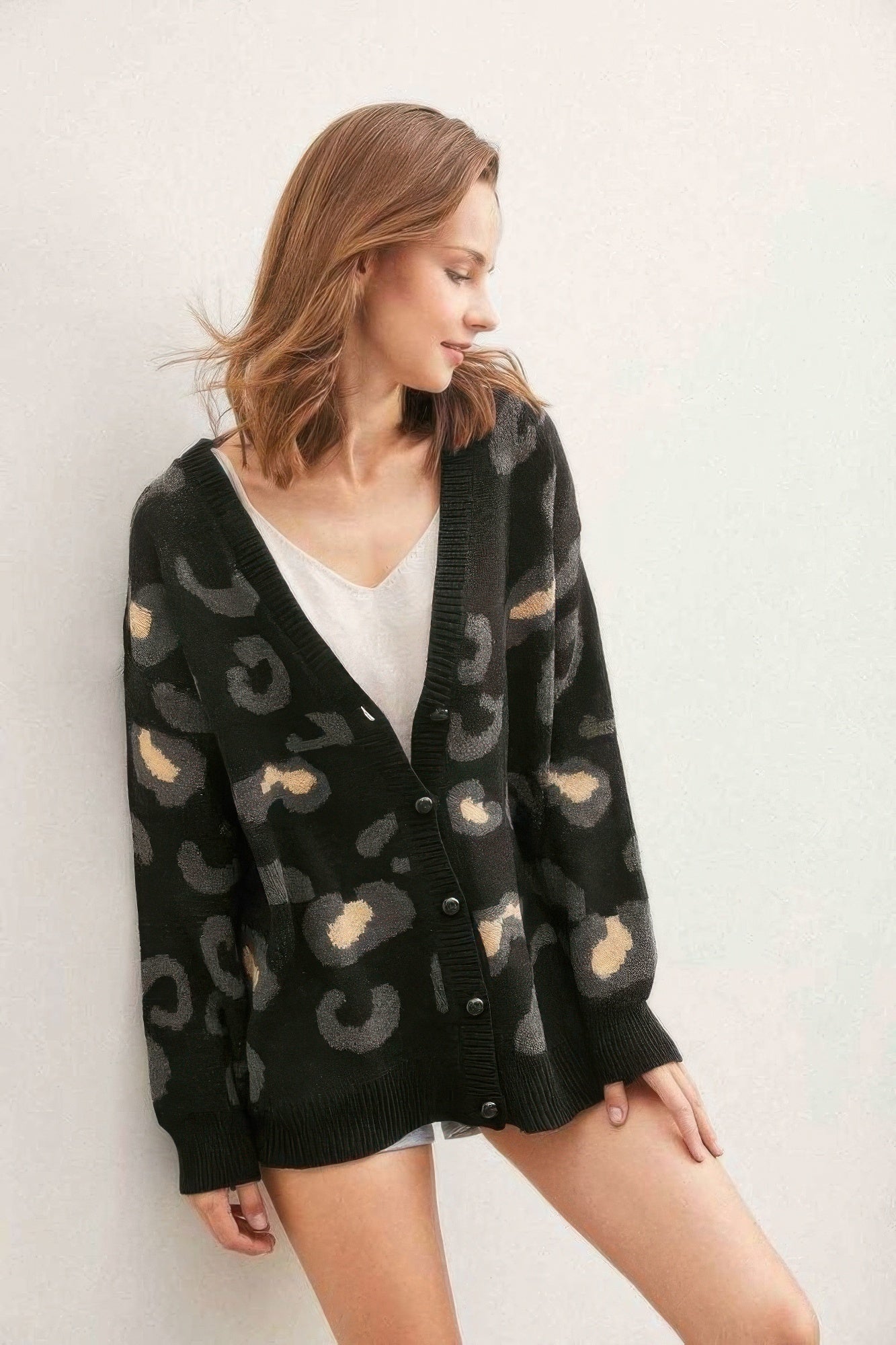 Leopard button-down cardigan, black with tan spot pattern, V-neck and front buttons