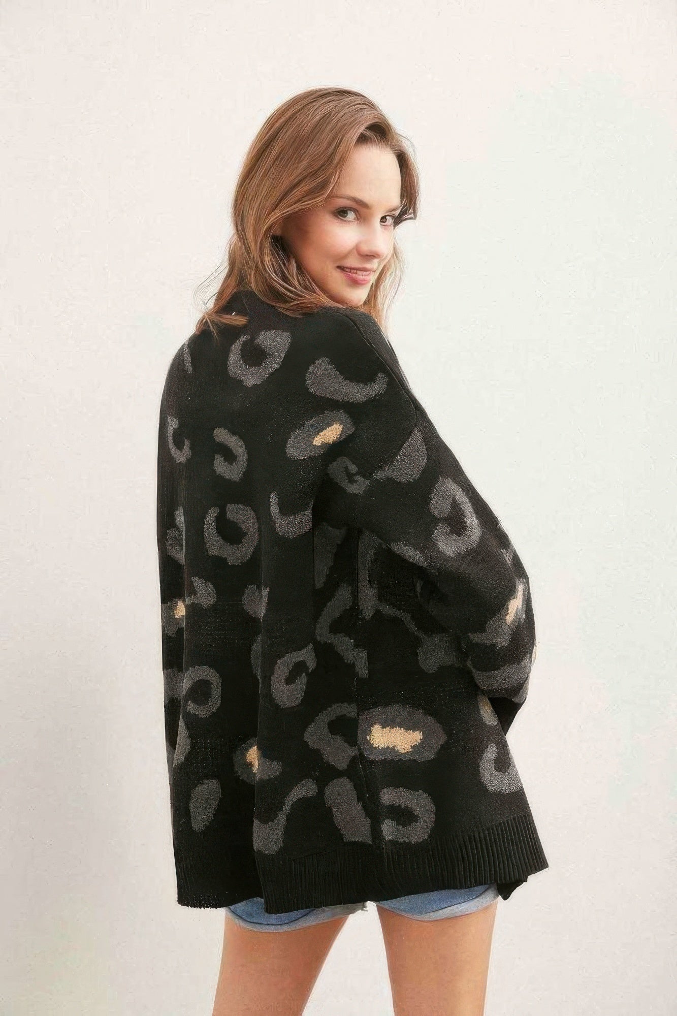 Leopard button-down cardigan, black with large tan leopard print, drop-shoulder