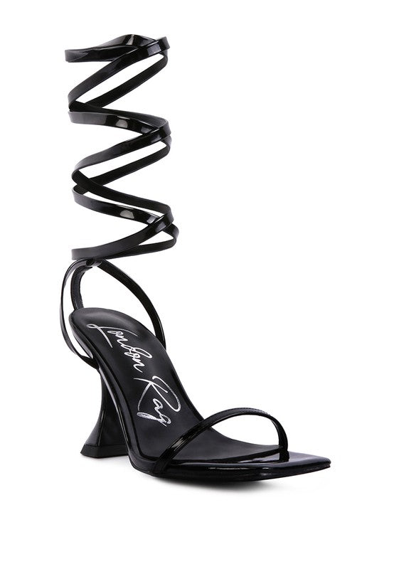 Black strappy tie-up spool heel sandals with open square toe and spiral ankle straps
