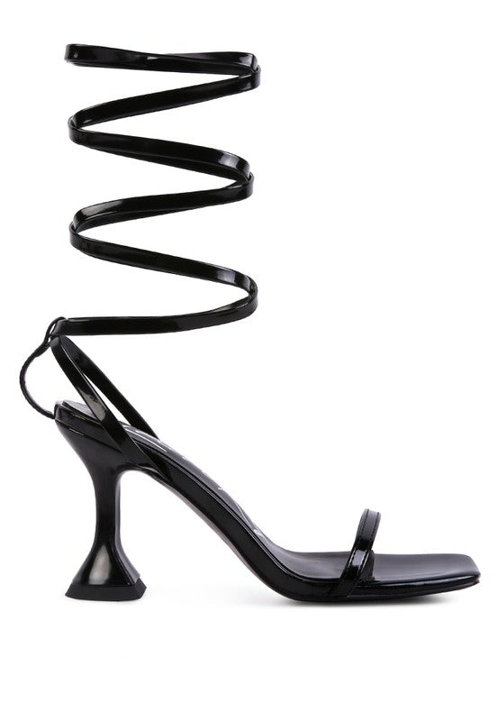 Black strappy tie-up spool heel sandals, side view with spiral ankle straps