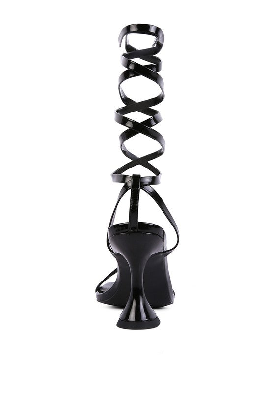 Black strappy tie-up spool heel sandals, back view with spiral ankle strap