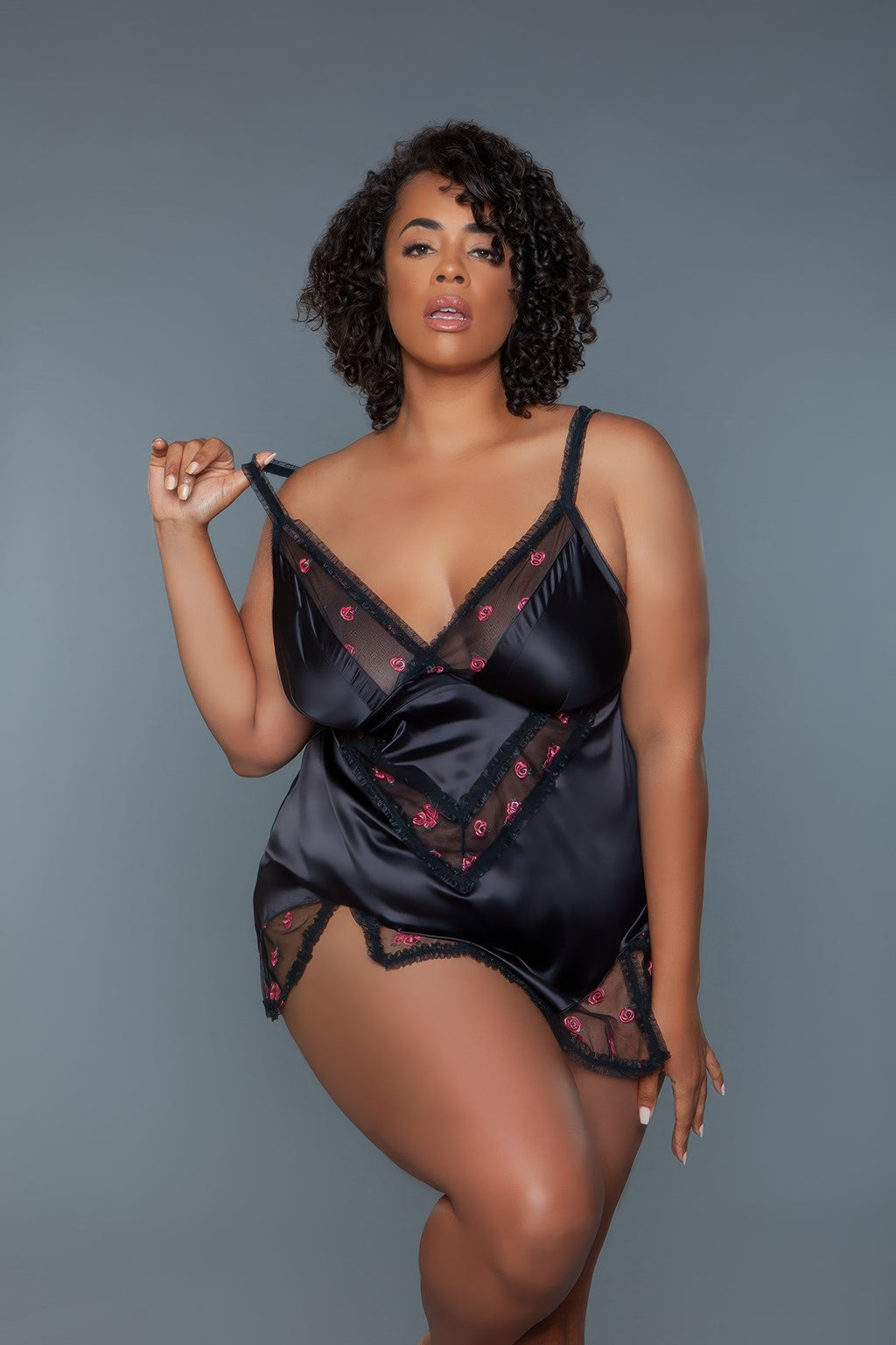 Black plus size babydoll lingerie with pink floral embroidery, V-neck and mesh lace sides