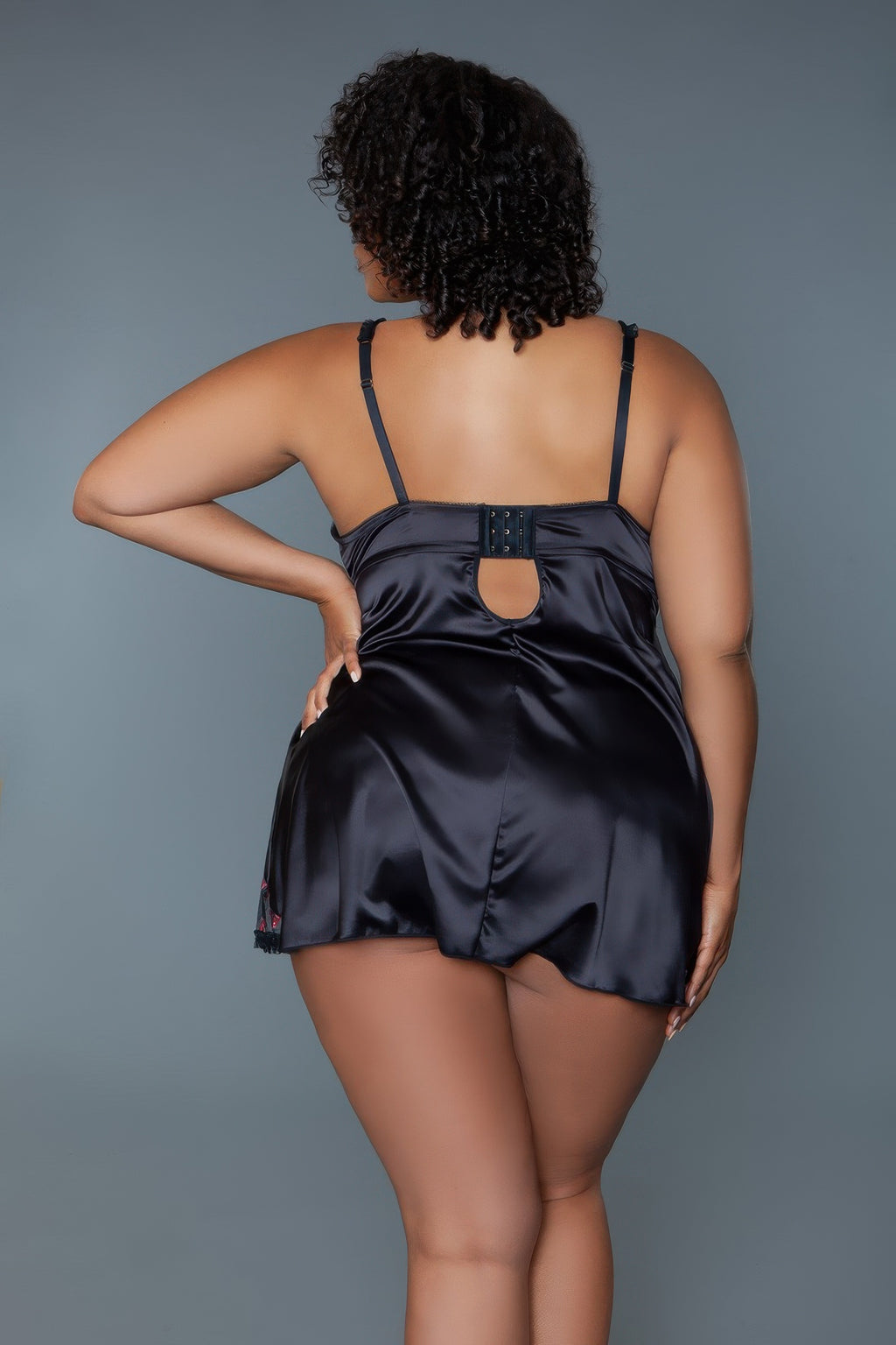 Black babydoll lingerie from back view, adjustable straps and cutout waist detail