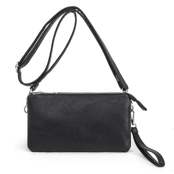 Black compact crossbody purse with adjustable shoulder strap and zip-top closure