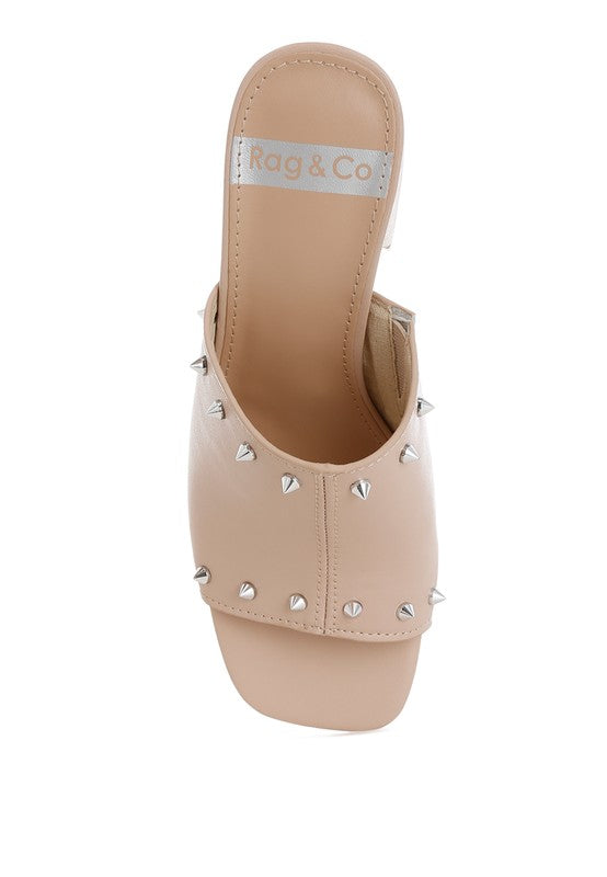 Beige studded mule upper with open toe and visible interior