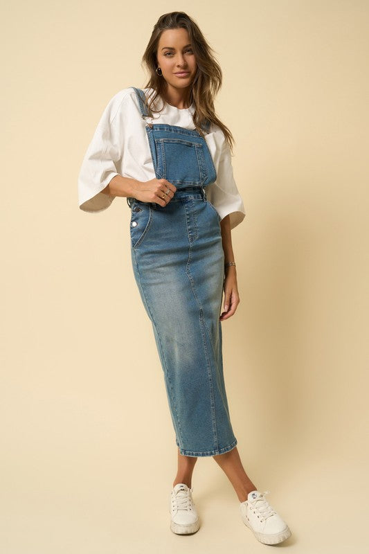 Long denim blue skirt overalls with front bib and adjustable straps