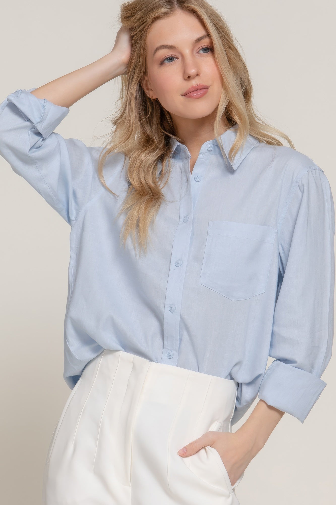Light blue long sleeve linen-blend button-up shirt with chest pocket and pointed collar