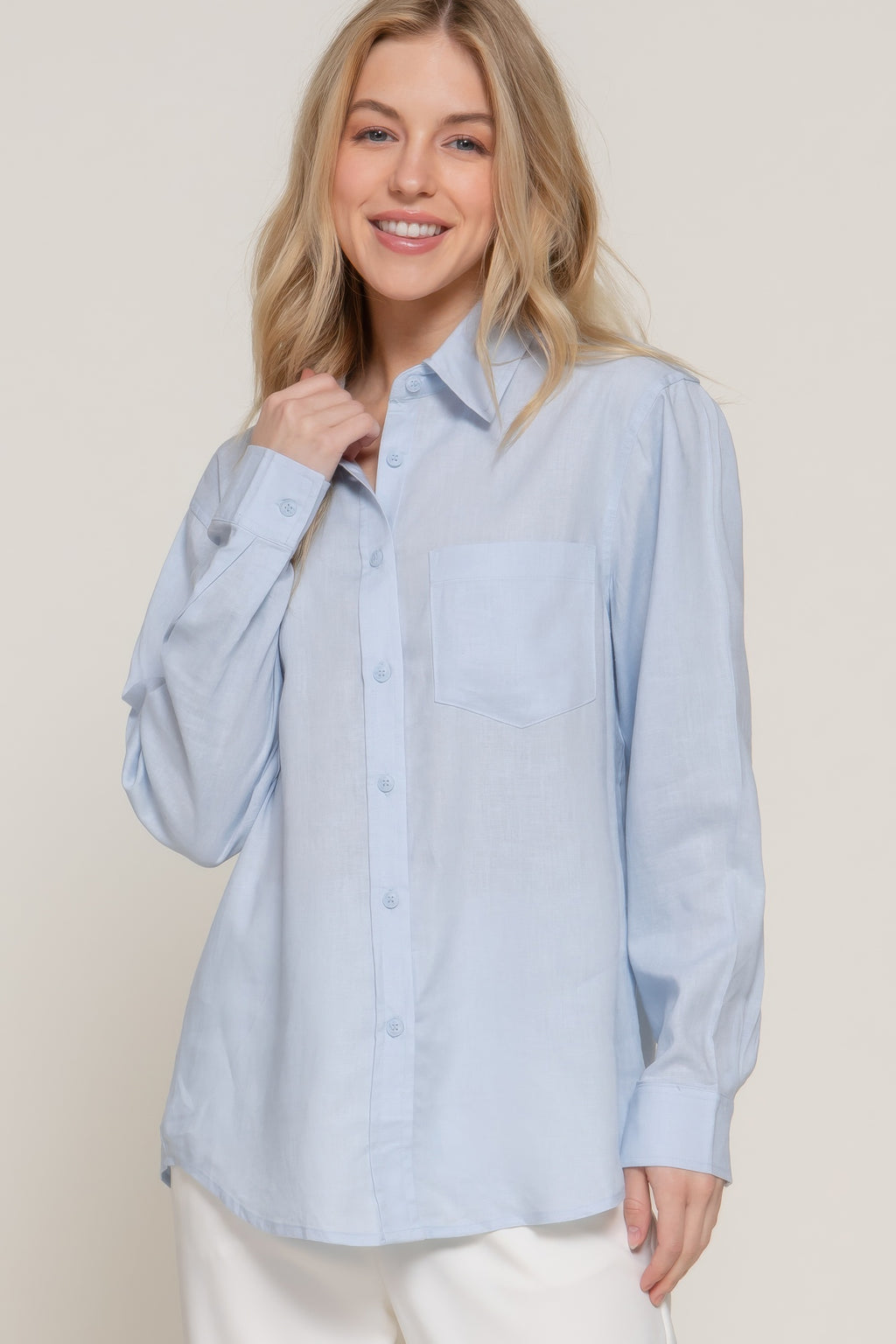Light blue linen-blend long sleeve shirt with collar, button front, and chest pocket