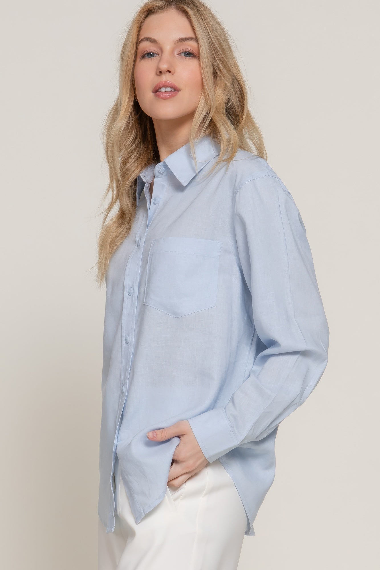 Light blue long sleeve linen-blend button-up shirt with pointed collar and chest pocket