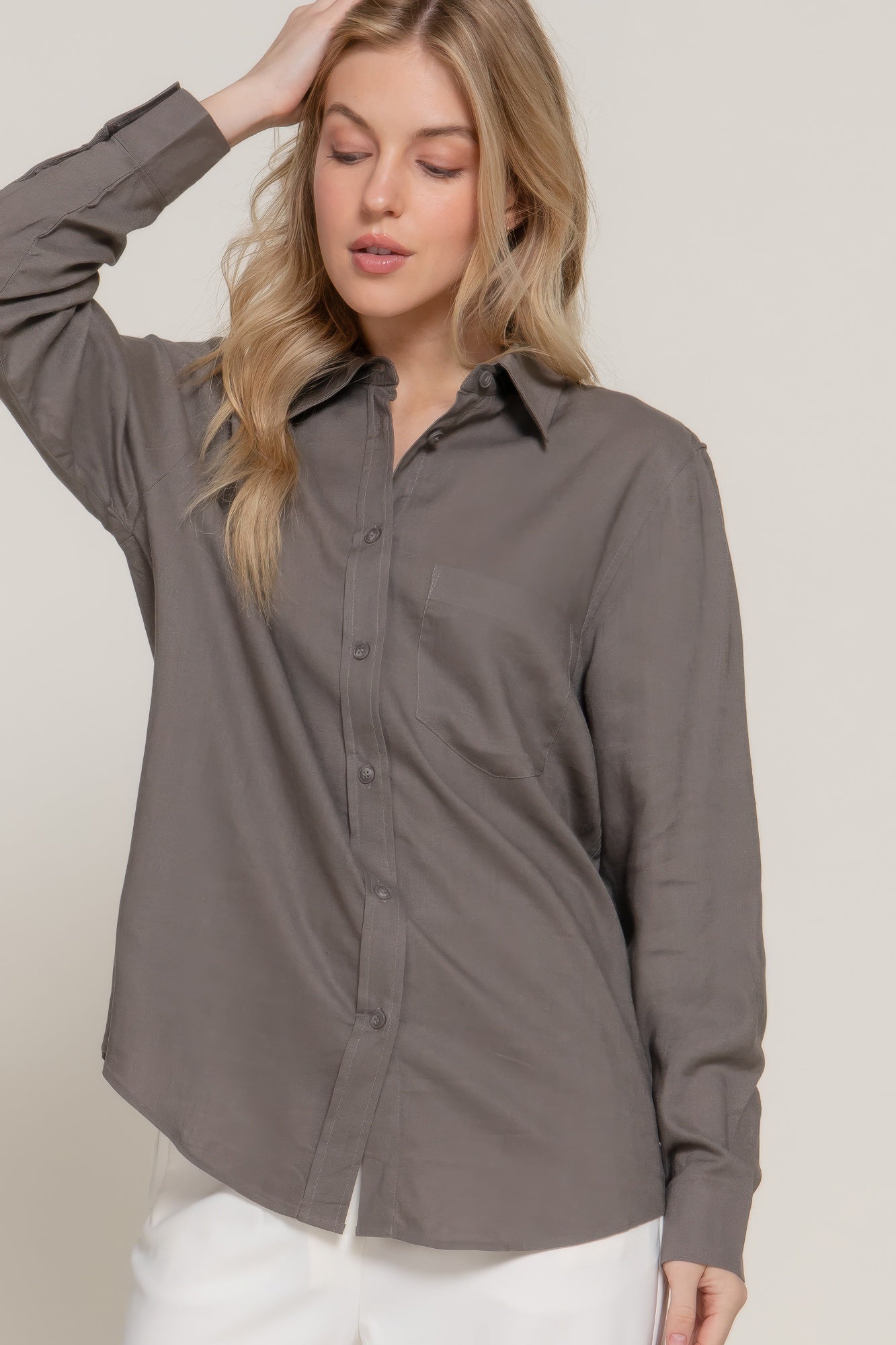 Dark gray linen-blend long sleeve shirt, side profile with button placket and pocket
