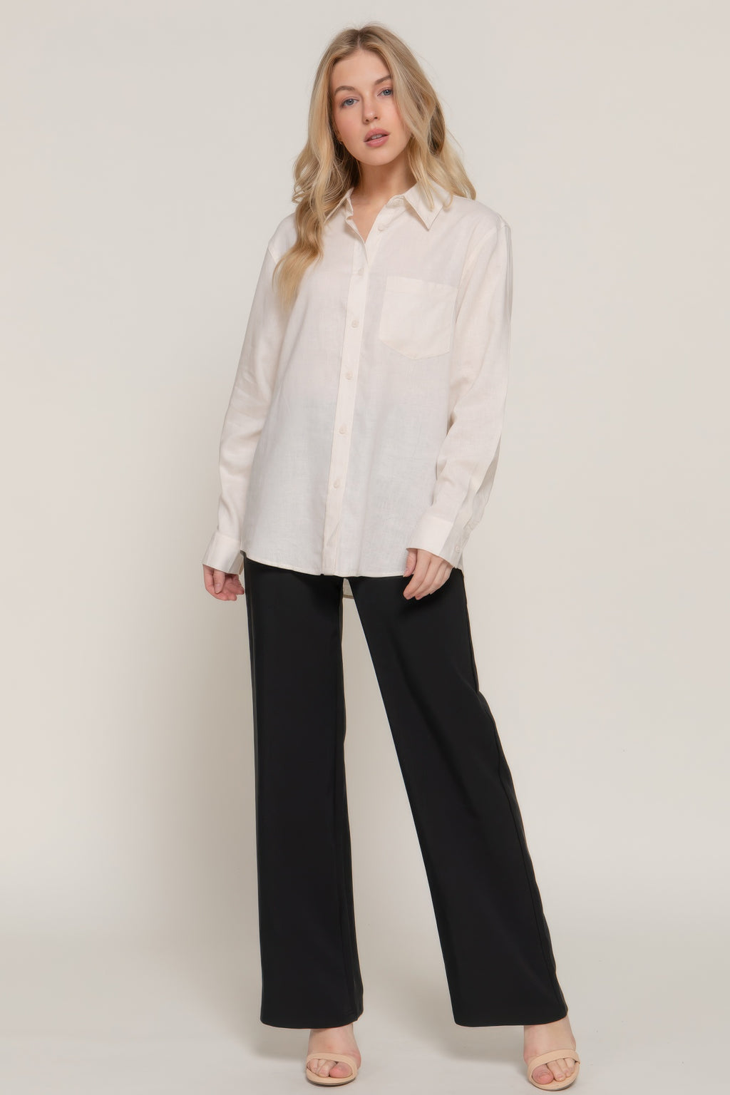 Natural long sleeve button-up linen blend shirt with collar; worn untucked