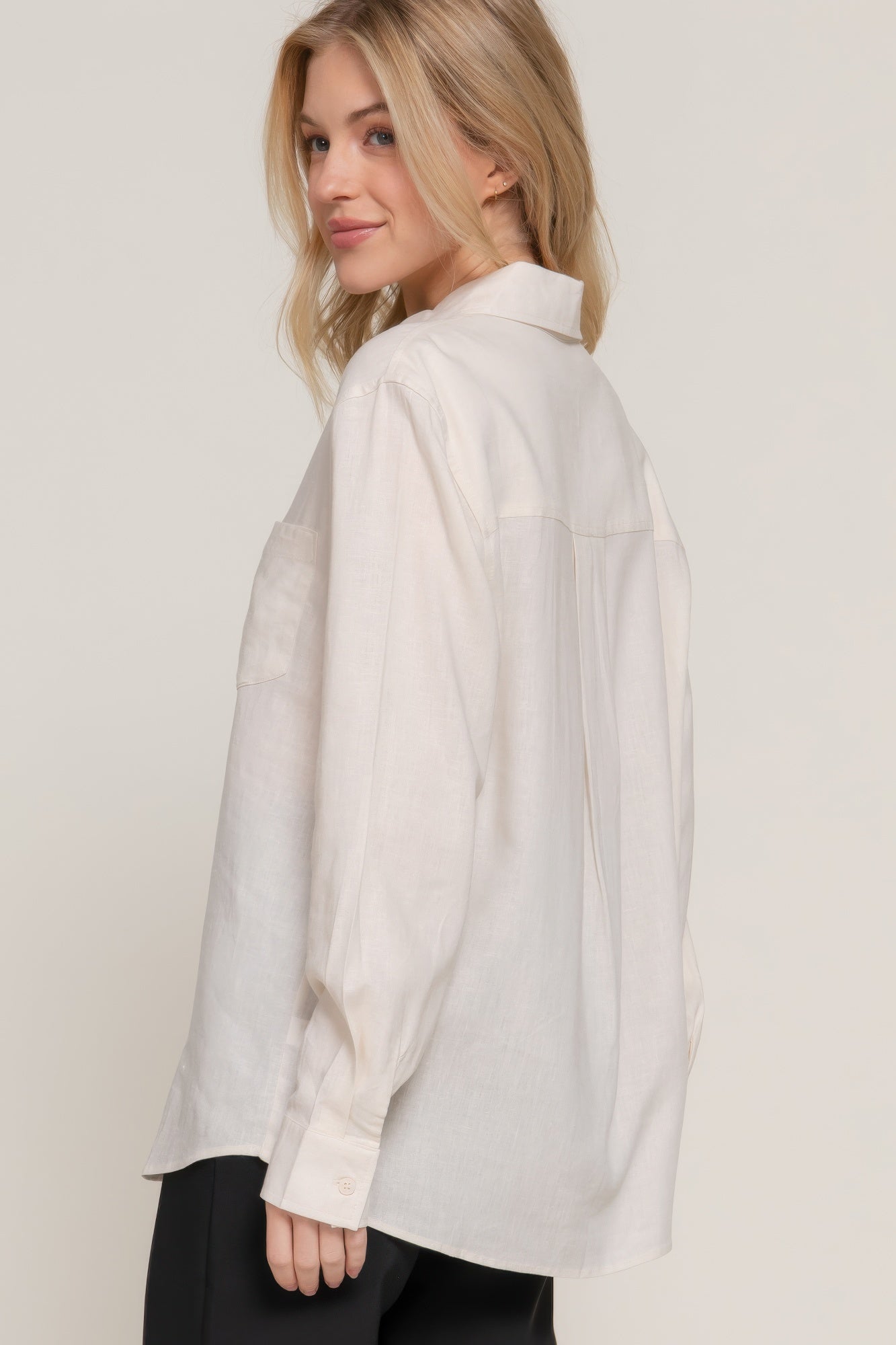 Natural long sleeve linen blend shirt from side view; buttoned placket