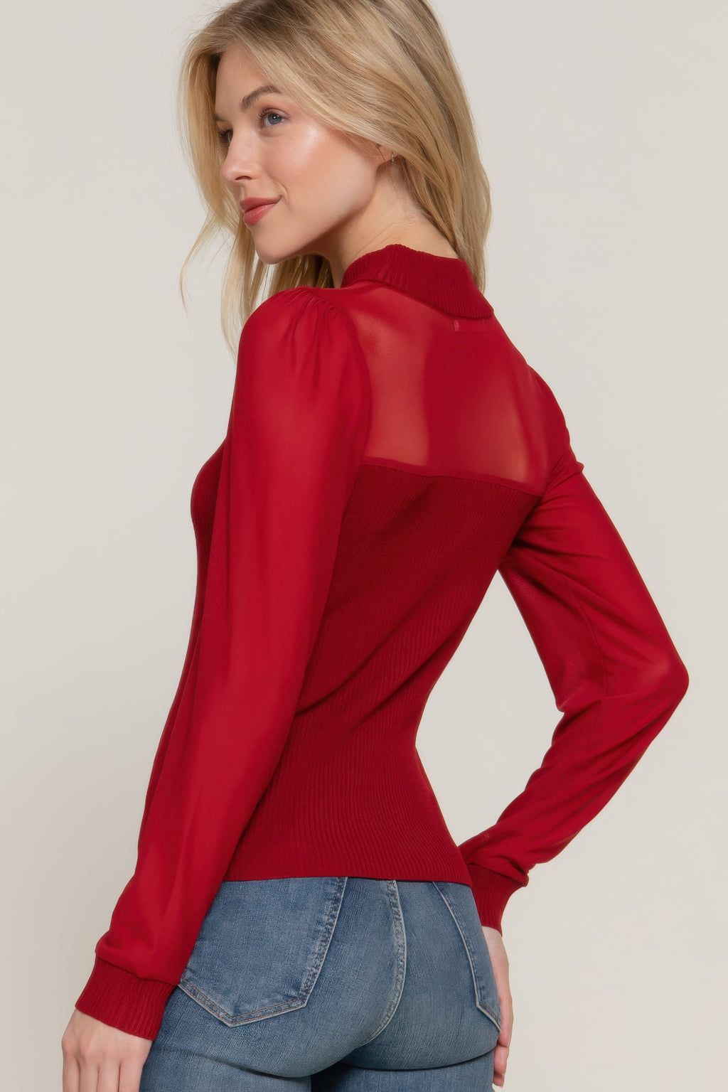 Burgundy sweater top with sheer mesh sleeves and fitted ribbed knit