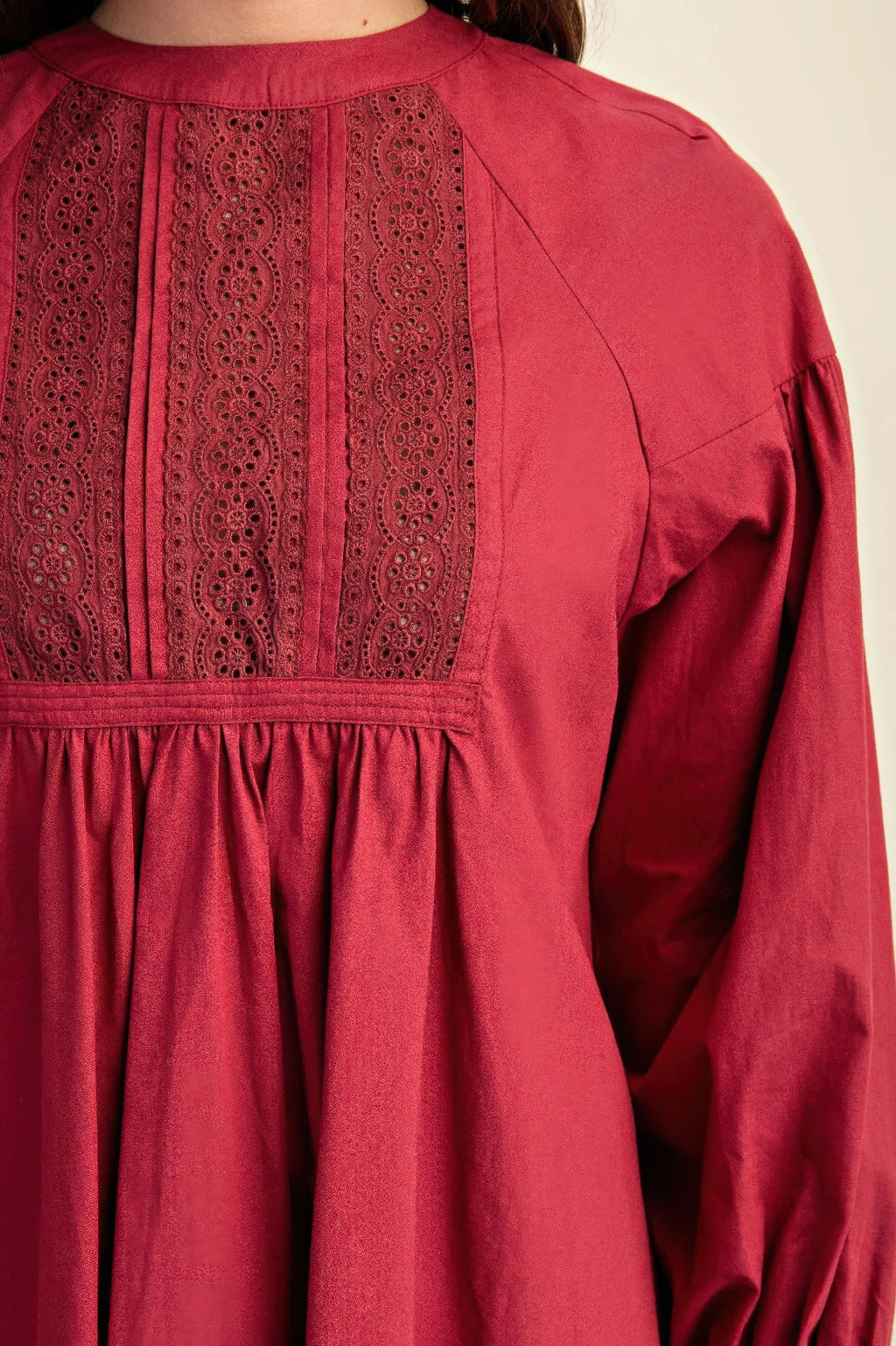Plum lace yoke mini dress detail, buttoned back and gathered waistband